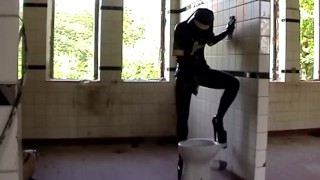 Black Latex Rubber Church Nun With High Heels Pisses Outdoor And Peeing In Pee Bag