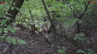 Mel walks naked in the wood