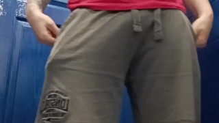 Muscle legs pose and piss at gym