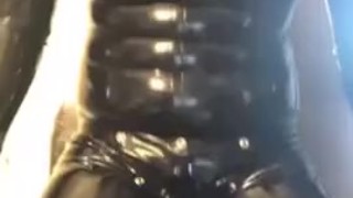 Full rubber gimp shows off suit and jerks off