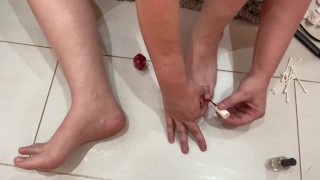 Pedicure/nail polish change on my big feet :) bright cherry red nails