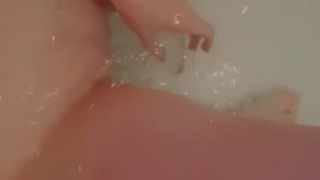 Beautiful baby gently caresses in the bathroom