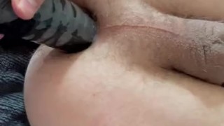 Shoving a 2 inch thick black dildo in my ass…