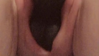 Pussy swallows black dildo