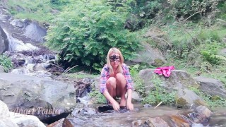 Exhibitionist teenage peeing and taking shower in the Waterfall river