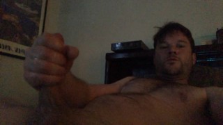 Lane strokes and edges his thick hard cock
