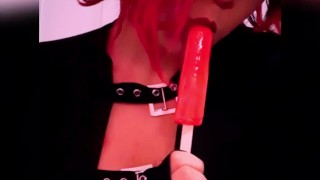 Goth babe licking & sucking red blowpop