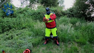 Forest Worker Pup pawing off in gear and boots (outdoors)