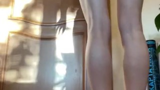 Girl with long legs does squats 