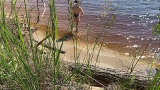 Sexy nudist girl on a wild beach