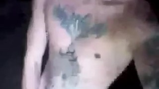 Horny inked twink smokes and flashes hard cock