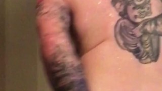 Hot tattooed guy massages his own cock and prostate in shower 