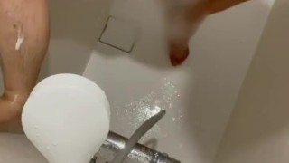 Japanese guy pissing while taking a shower