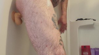 Riding a huge dildo in the shower 