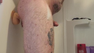 Riding a huge dildo in the shower 