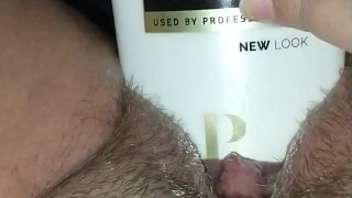 Bunni Stretching with thick conditioner bottle