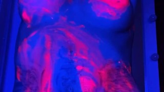 babe in neon in paint plays with pussy