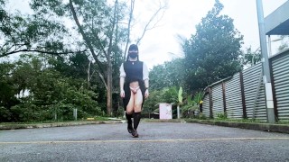 Sissy in chastity catwalk outdoors