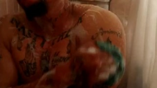 Thug jacks off until he cums on himself