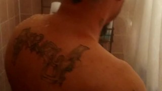 Sexy guy taking shower at the gym