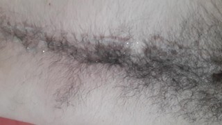 Laid back otter masturbating, shooting cum on hairy belly and chest