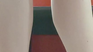 In a public shop Nicoletta tries on sandals with her sweaty feet all dirty