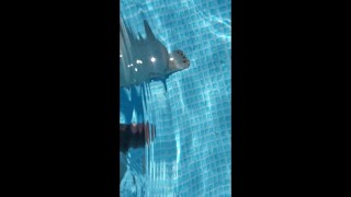 Naked and peeing in the pool.