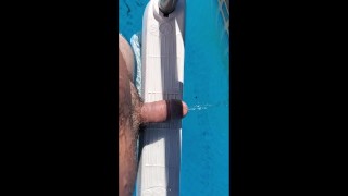 Naked and peeing in the pool.