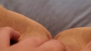 Amateur rubs clit and pussy, squirts fountain