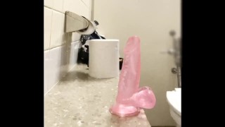 Dildo in anal in public toilet