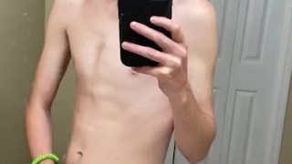 bored twink in a bathroom stroking thick cock