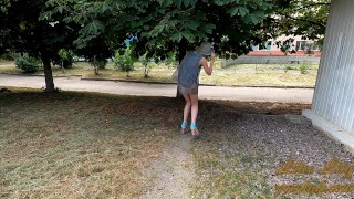 Slut walks in a mini dress with a fully transparent skirt