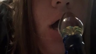 Sexy brunette teasing you with her glass dildo