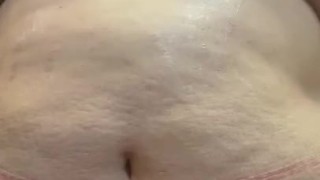 Rubbing down my fat tummy in lotion