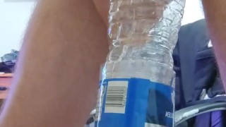 Pissing in the empty bottle like a champ