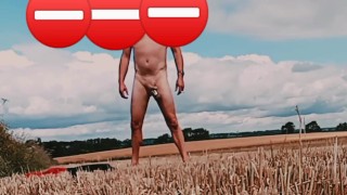 Fat cock and ball weights naked in corn field