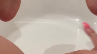 Hot milf alone in her bathroom rubbing her shaved pussy 