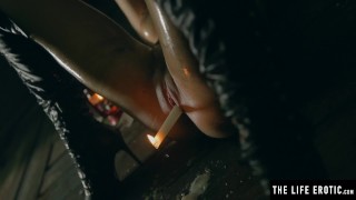 Sexy brunette squirting as she fucks herself with a lit candle