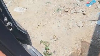 Pissing near car on the side of a busy mountain road - Angel Fowler 