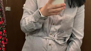Pregnant beauty masturbates in a clothing store and tries on dresses