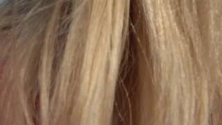 PUBLIC ON A BENCH. A SUNNY DAY A CUTE PUSSY