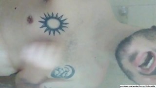 White tattooed boy plays with himself in the shower till cum