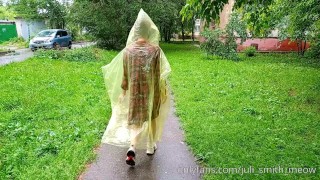 Risky flash of boobs and butt in the rain in a transparent raincoat