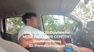 Cumming in a parking lot