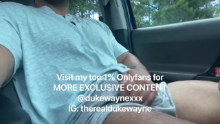Cumming in a parking lot