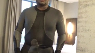 showing dolphin wetsuit bulge and silicone mask at hotel door and window, no cum