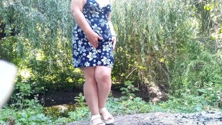 Peeing standing through pink panties in nature