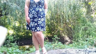 Peeing standing through pink panties in nature