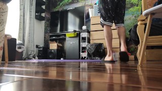 Very skinny lad stretches out his body on a yoga mat