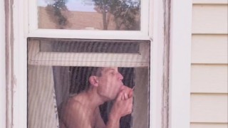 Neighbor Twink using dildo on ass and mouth in window